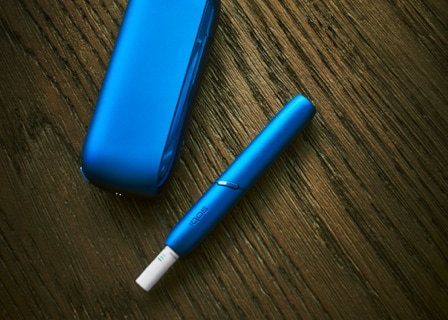 Stellar blue IQOS 3 DUO holder with HEETS stick and charger